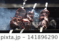 Pork kebab is cooked on the grill 141896290