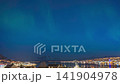 Tromso Norway time lapse of the aurora borealis northern lights at city sentrum skyline harbor 141904978