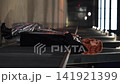 Portrait of a beautiful fiery red-haired woman on a city street at night. 141921399