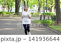 Woman jogging in the park Woman jogging in the park 141936644