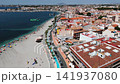 Aerial view of sandy coastline and beachfront buildings of Lo Pagan town 141937080