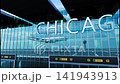 Airlane landing at Chicago, USA. Arrival in the city with reflection of airport and aircraft 141943913