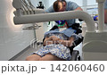 Dentist Performs Precise Dental Treatment Using Professional Microscope in Modern Clinic 142060460