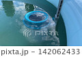 Pool skimmer net cleaning water surface 142062433