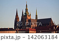 The Gothic towers and spires of St. Vitus Cathedral at Prague Castle in warm sunrise light, Prague, Czech Republic 142063184