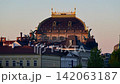 The roof of the National Theatre with its bronze chariot statues and gilded crest at sunrise, Prague, Czech Republic 142063187