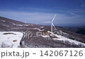 Wind turbines lined up amid the snow-covered peaks of Mount Hakkoda | Aerial view of Aomori Prefecture's renewable energy infrastructure 142067126