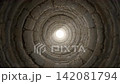 A flight through an old, bright stone tunnel with light at the end 142081794
