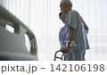 Asian senior older adult couple husband wife physical rehabilitation walking practice together 142106198