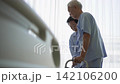 Asian senior older adult couple husband wife physical rehabilitation walking practice together 142106200