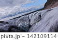 Dynamic FPV drone flight skimming above and between deep glacier crevasses on glacier, Iceland. Cinematic aerial footage revealing blue ice formations and dramatic glacial landscape. Dynamic FPV drone flight skimming above and between deep glacier crevasses on glacier, Iceland. Cinematic aerial footage revealing blue ice formations and dramatic glacial landscape. 142109114