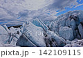 Dynamic FPV drone flight skimming above and between deep glacier crevasses on glacier, Iceland. Cinematic aerial footage revealing blue ice formations and dramatic glacial landscape. Dynamic FPV drone flight skimming above and between deep glacier crevasses on glacier, Iceland. Cinematic aerial footage revealing blue ice formations and dramatic glacial landscape. 142109115