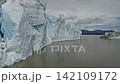Cinematic aerial flight above the spectacular glacier front of Fjallsarlon Glacier Lagoon in Iceland, revealing deep crevasses, blue glacial ice and the dramatic landscape of Vatnajokull. Cinematic aerial flight above the spectacular glacier front of Fjallsarlon Glacier Lagoon in Iceland, revealing deep crevasses, blue glacial ice and the dramatic landscape of Vatnajokull. 142109172