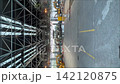 Heavy machinery used to process waste at a waste treatment facility and the interior of the factory. 142120875
