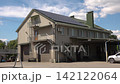 Solar panels installed on the roof of a city building. Concept of eco friendly and alternative power source.  142122064