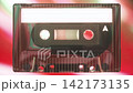 Vintage Music Tape Close-Up Against Colorful Glowing Background 142173135