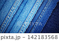 Abstract background Blue denim fabric showing detailed woven texture, Seams and contrasting stitching for textile and fashion backgrounds 142183568