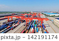 Aerial view of Chengdu International Railway Port in China featuring China Europe Railway Express container freight and orange cranes 142191174