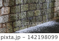 Water Flowing Down Textured Natural Stone Wall Feature 142198099