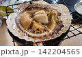 April 30 2026 Fresh scallops grilled in shells with soy sauce. 142204565
