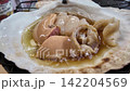 April 30 2026 Fresh scallops grilled in shells with soy sauce. 142204569