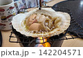 April 30 2026 Fresh scallops grilled in shells with soy sauce. 142204571