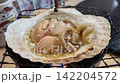 April 30 2026 Fresh scallops grilled in shells with soy sauce. 142204572