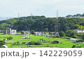 The scenery of Japanese rural villages and satoyama (traditional rural landscapes) with vast expanses of green rice fields in summer. 142229059