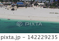 Aerial shot on Zanzibar, beautiful resort,turquoise indian ocean and people walking on the Kendwa beach, Zanzibar ,Tanzania 142229235