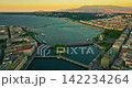 Establishing shot of Geneva city. Aerial view of the Swiss lake town. Rooftops of houses and the lake bay 142234264