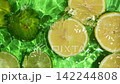 Overhead Slow Motion of Lemon and Lime Halves in Water 142244808