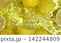 Overhead Slow Motion of Lemons Dropping into Water. 142244809
