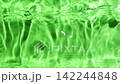 Abstract green water surface background with gentle waves and copy space in slow motion 142244848