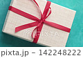 Gift delivery. Pandemic holidays. Hands in protective gloves bringing wrapped present boxes on teal blue textured background set of 4. 142248222