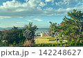 A view from the window of a Shinkansen train, showing Lake Biwa. 142248627