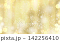 A winter-themed background animation with snow falling against a gold background. 142256410