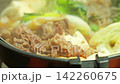 Steaming hot sukiyaki: A Japanese hot pot dish of beef and vegetables simmered together. 142260675