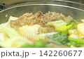 Steaming hot sukiyaki: A Japanese hot pot dish of beef and vegetables simmered together. 142260677