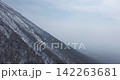Drone aerial photography circling near the summit of Mt. Daisen in spring. 142263681