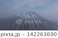 Drone aerial footage zooming out from the snow-covered summit of Mt. Daisen. 142263690