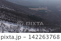 Drone aerial footage of Mt. Daisen flying along the mountainside in the backlight. 142263768