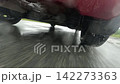 A Dynamic Perspective of a Car in Motion on a Rainy Day: Capturing the Thrill and Intensity of Speed and Wet Road Conditions 142273363
