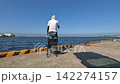 A man fishing with a sabiki rig at the pier of Hachinohe Port in Aomori Prefecture, Hachinohe City. 142274157