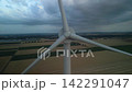 Aerial View Drone Reversing Away From Wind Turbine Rotor Hub at Dusk 142291047