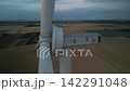 Title: Aerial View Drone Orbiting Around Wind Turbine Nacelle Close Up at Dusk 142291048