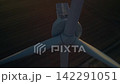 Aerial Close Up Drone Descending Past Wind Turbine Rotor Hub at Dusk 142291051