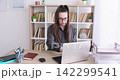 Business routine. Professional atmosphere. Busy woman manager at office desk with laptop working with documents at modern workspace. 142299541