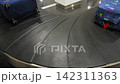 Airport baggage carousel with lots of suitcases moving around, travel, 4k 142311363