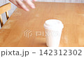 A woman brings her laptop to an empty seat and starts working. 142312302