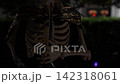 Close-up Halloween skeleton with bright glowing eyes, a top hat, and a dark cape. Bokeh lights and a suburban yard at night create a spooky festive scene. 142318061